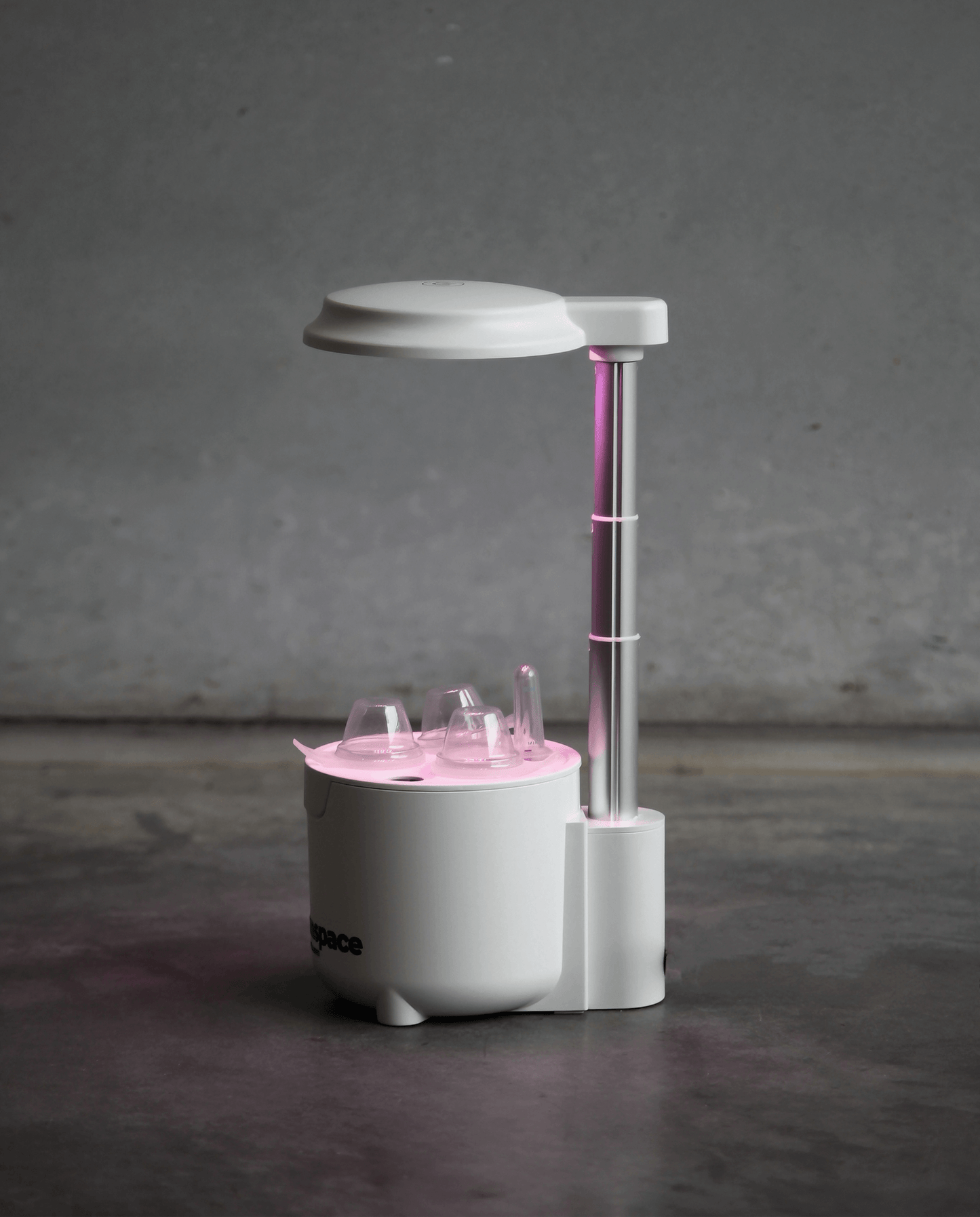 xGreenspace MiniBlock 3pc Y03B hydroponic system with pink LED light for indoor plant growth in compact spaces.