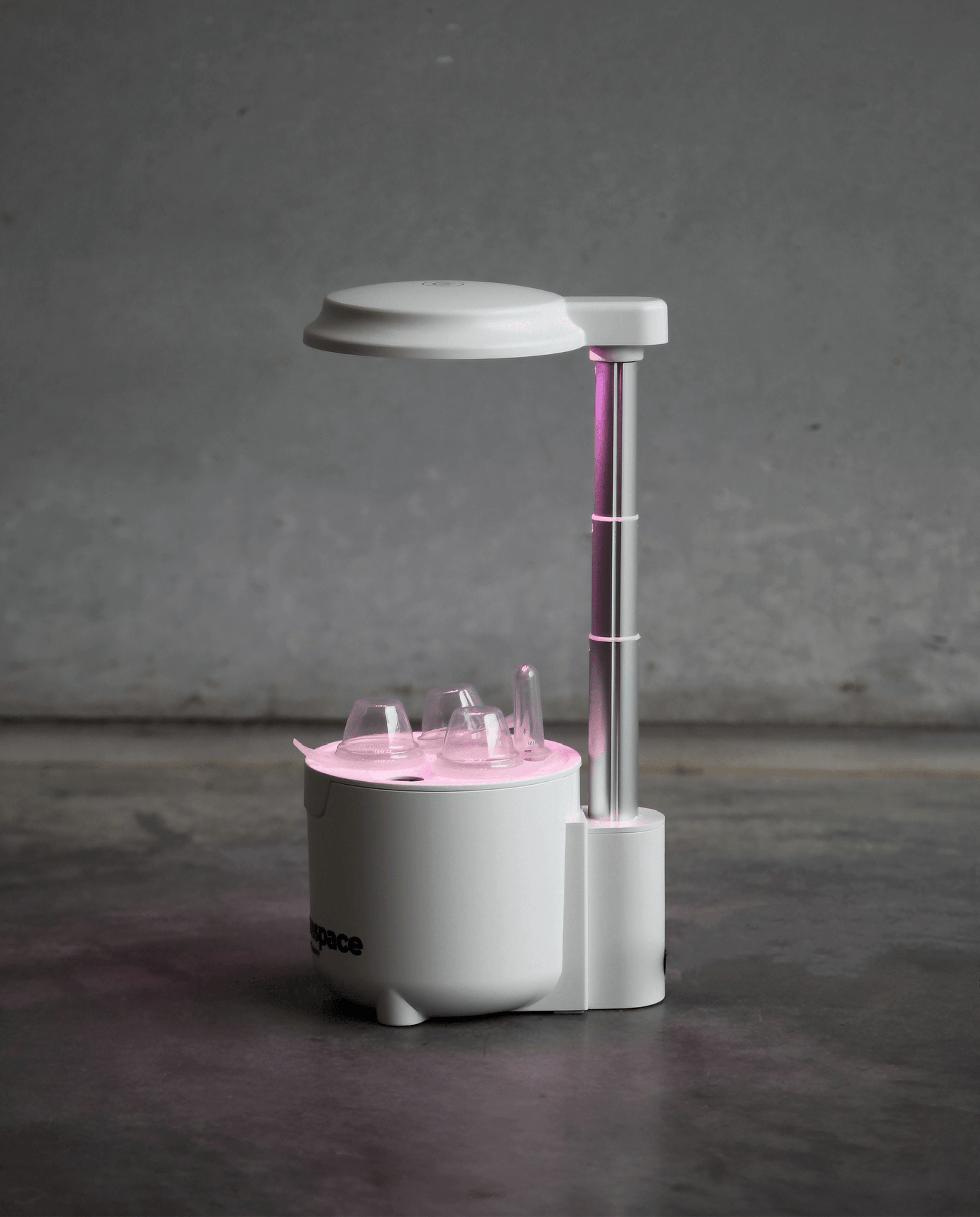 xGreenspace MiniBlock 3pc Y03B hydroponic system with pink LED light for indoor plant growth in compact spaces.